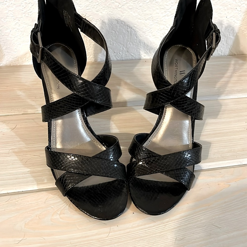 Size 8 black criss cross strap heels with silver side buckle zipper on back.